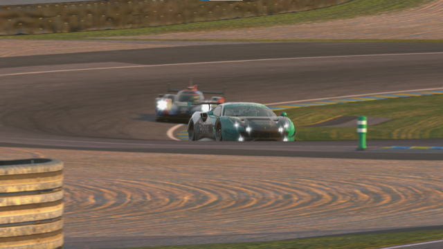 The Gumption Racing Ferrari about to be overtaken by a prototype (again) as the sun starts to set